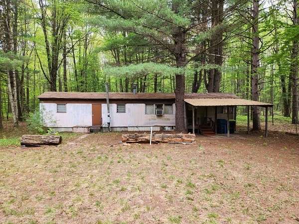 5 Acres of Residential Land with Home for Sale in Beaverton, Michigan