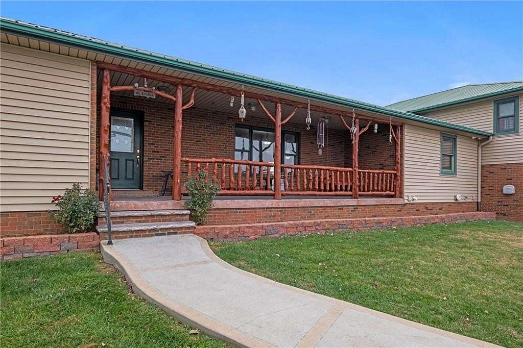 77.9 Acres of Agricultural Land with Home for Sale in Weatherby, Missouri