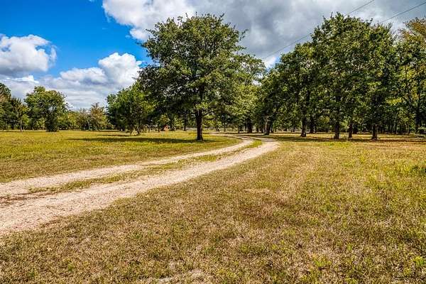 33.6 Acres of Agricultural Land with Home for Sale in Bedias, Texas