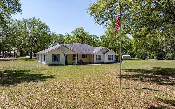 4 Acres of Residential Land with Home for Sale in McAlpin, Florida