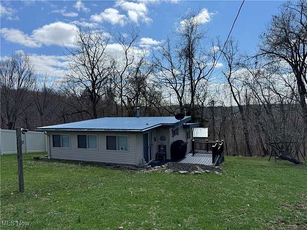 0.41 Acres of Residential Land with Home for Sale in Piedmont, Ohio