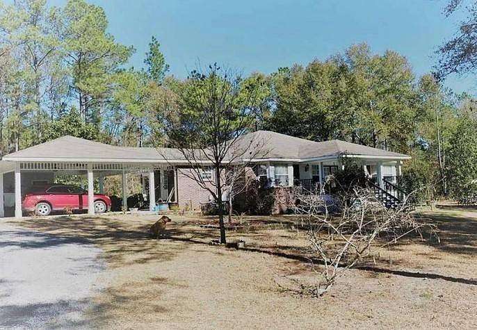 20 Acres of Land with Home for Auction in Chunchula, Alabama
