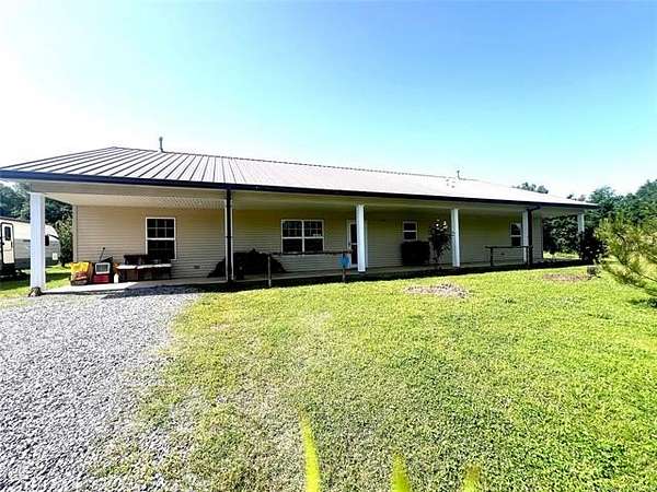 2.13 Acres of Residential Land with Home for Sale in Hartshorne, Oklahoma