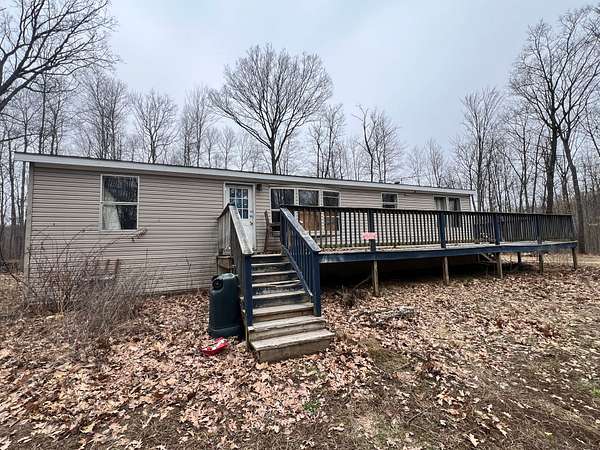 34.6 Acres of Recreational Land with Home for Sale in Harrison, Michigan