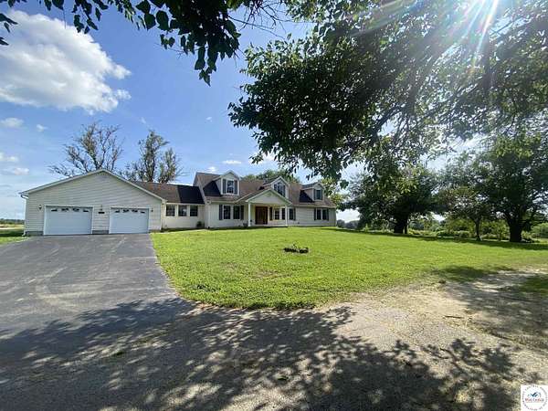 5.57 Acres of Land with Home for Sale in Lowry City, Missouri