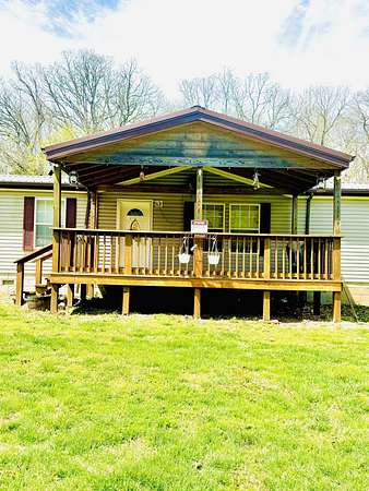10.4 Acres of Land with Home for Sale in Crane, Missouri