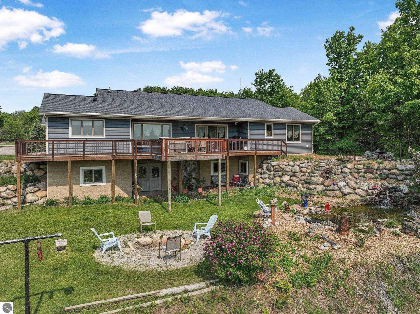 3.5 Acres of Residential Land with Home for Sale in Kewadin, Michigan