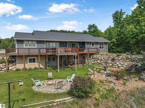 3.5 Acres of Residential Land with Home for Sale in Kewadin, Michigan