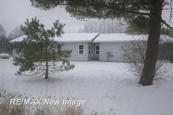 7.1 Acres of Residential Land with Home for Sale in Beaverton, Michigan