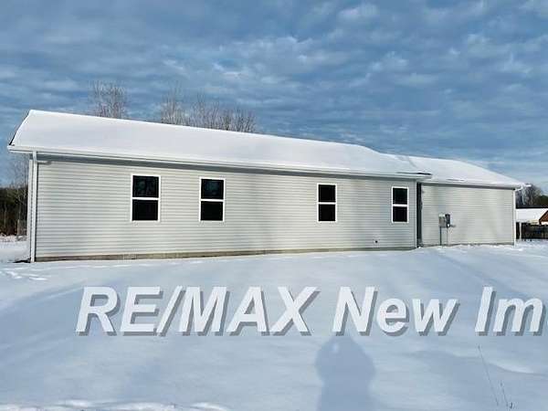 7.1 Acres of Residential Land with Home for Sale in Beaverton, Michigan