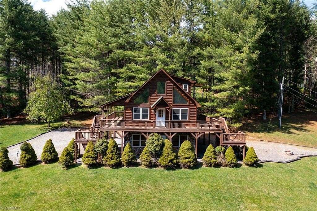 2.74 Acres of Residential Land with Home for Sale in Grassy Creek, North Carolina