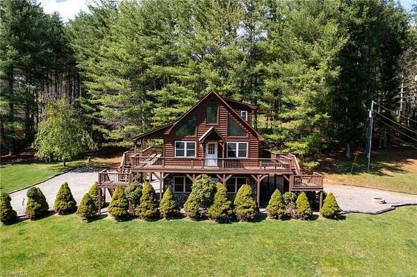 2.74 Acres of Residential Land with Home for Sale in Grassy Creek, North Carolina