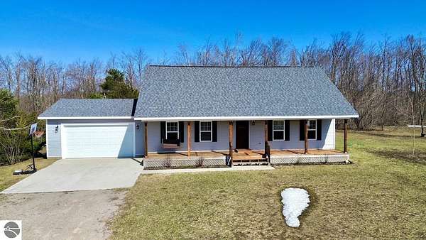 1.5 Acres of Residential Land with Home for Sale in Elmira, Michigan