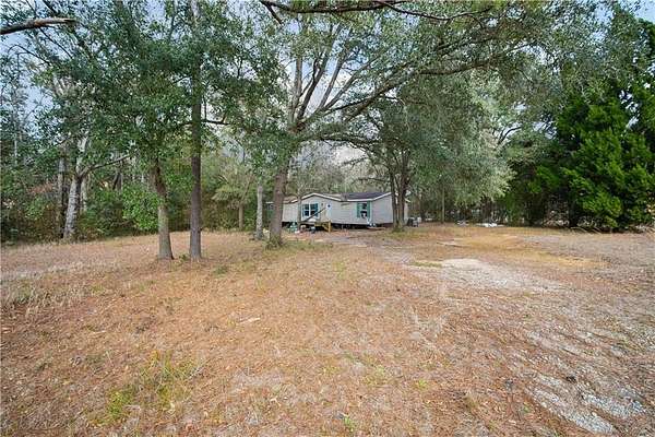 1.55 Acres of Residential Land with Home for Sale in Grand Bay, Alabama