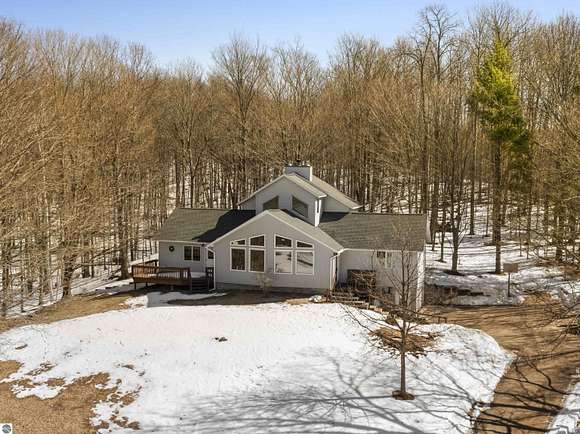 20.6 Acres of Recreational Land with Home for Sale in Honor, Michigan