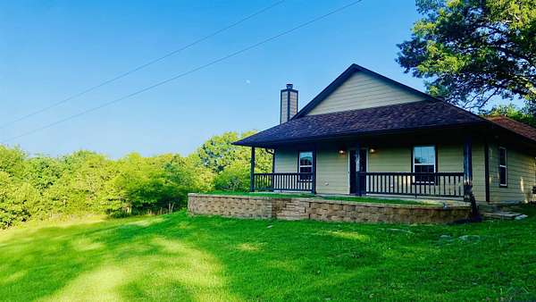 9.7 Acres of Residential Land with Home for Sale in Harleton, Texas