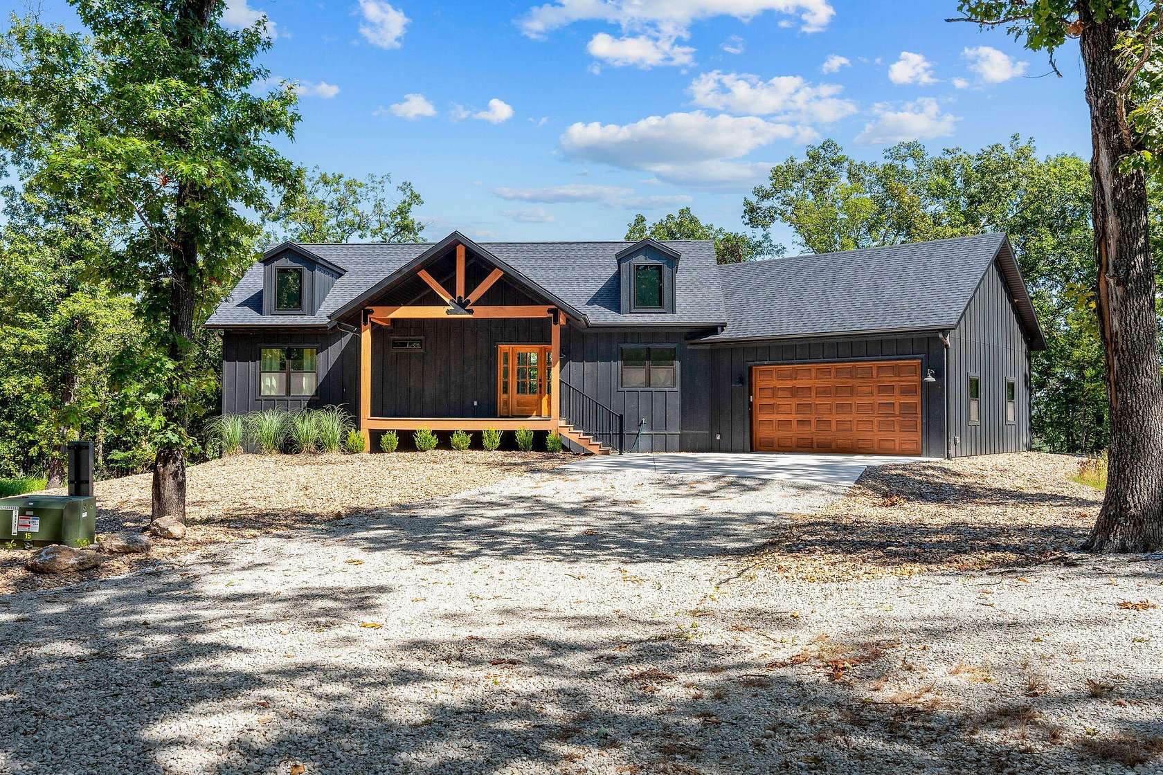 10.8 Acres of Land with Home for Sale in Lampe, Missouri