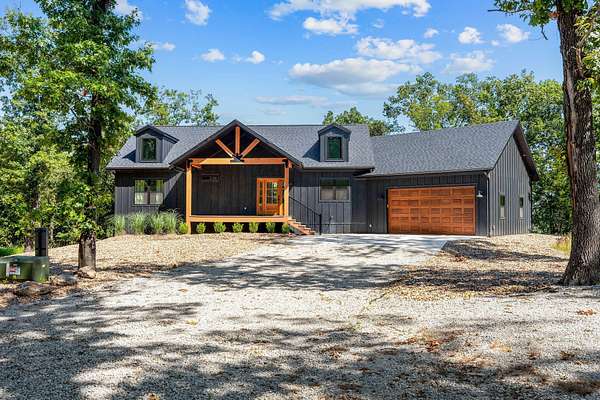 10.8 Acres of Land with Home for Sale in Lampe, Missouri