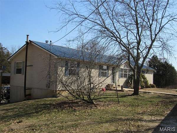 28.6 Acres of Agricultural Land with Home for Sale in Luebbering, Missouri