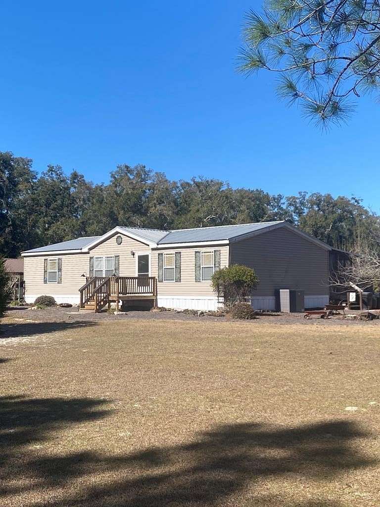 75.3 Acres of Agricultural Land with Home for Sale in Chiefland, Florida