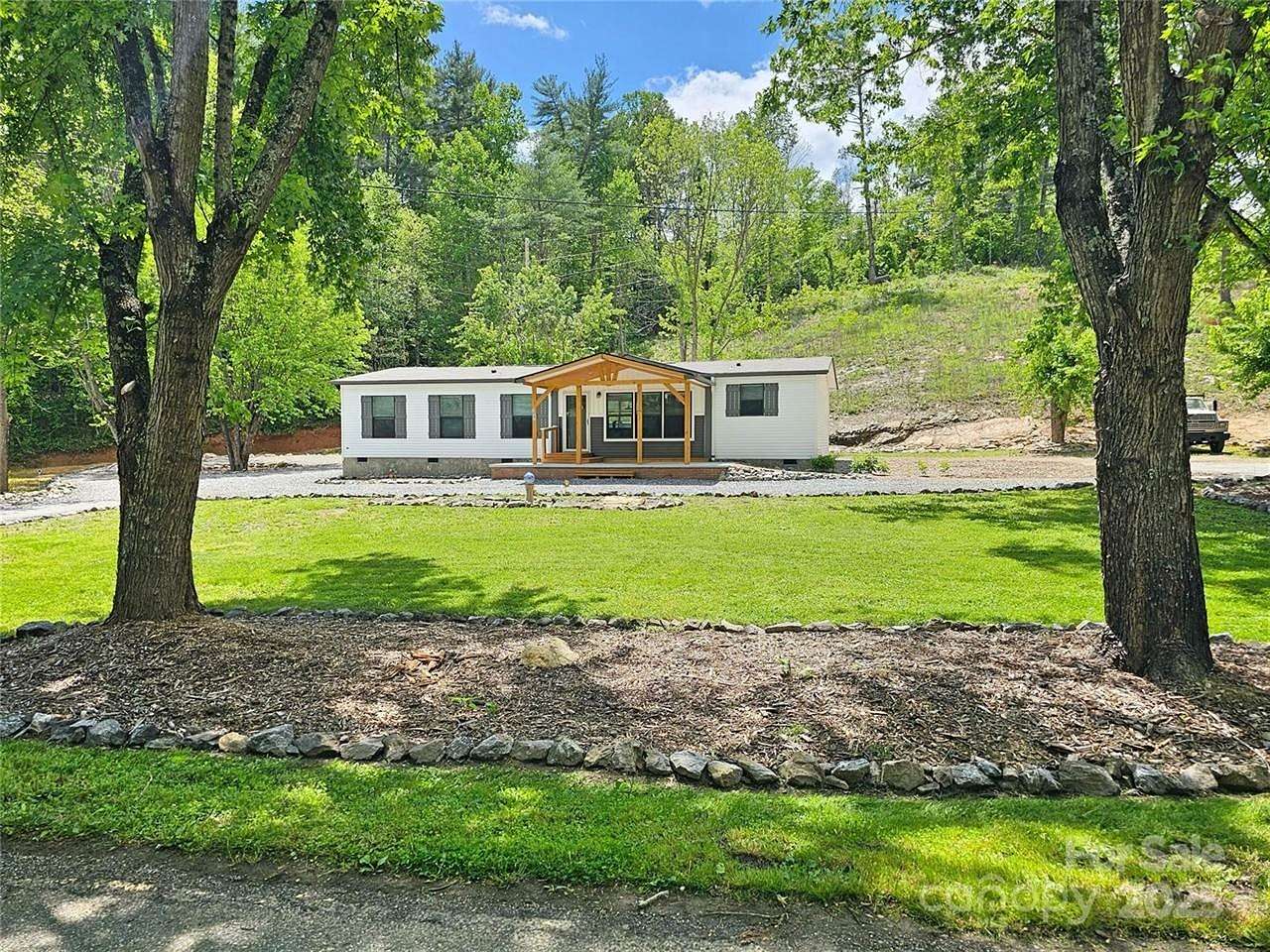 1.5 Acres of Residential Land with Home for Sale in Marshall, North Carolina