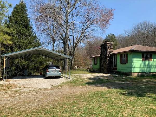 1.5 Acres of Residential Land with Home for Sale in Pettigrew, Arkansas