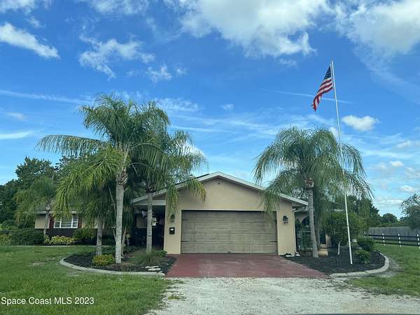 1.76 Acres of Residential Land with Home for Sale in Palm Bay, Florida