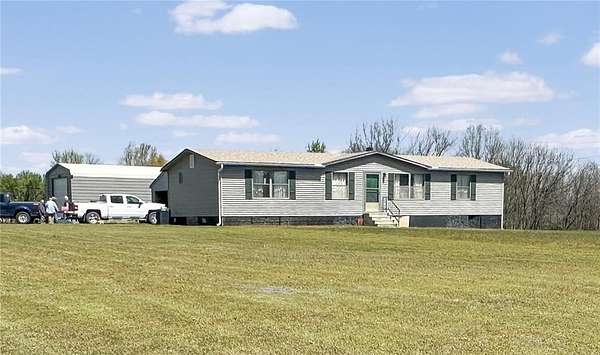 5.6 Acres of Residential Land with Home for Sale in Deepwater, Missouri