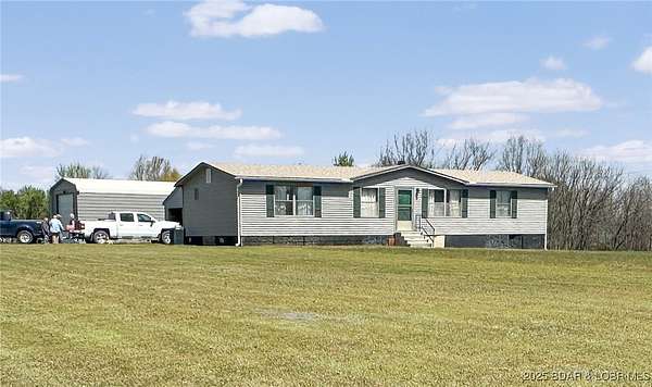 5.6 Acres of Residential Land with Home for Sale in Osage Township, Missouri