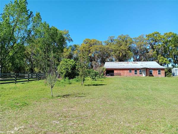 10.9 Acres of Land with Home for Sale in Citra, Florida