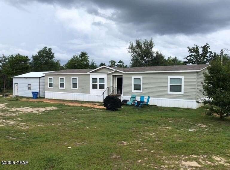 10 Acres of Residential Land with Home for Sale in Fountain, Florida