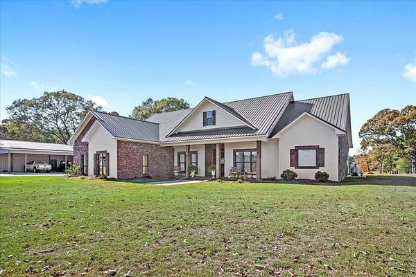 10 Acres of Residential Land with Home for Sale in Columbia, Mississippi