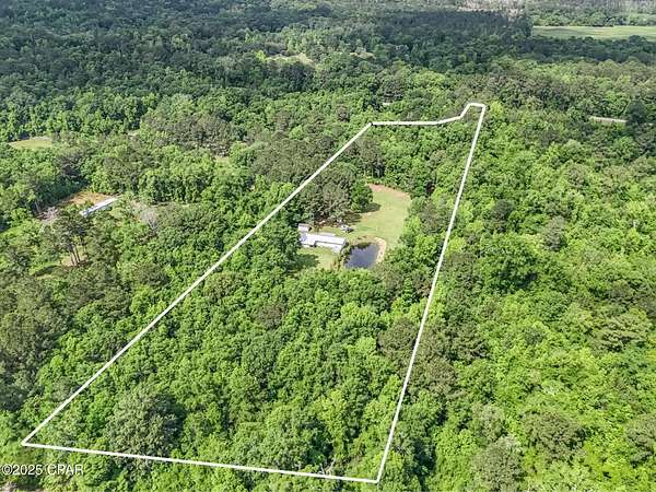 9.9 Acres of Residential Land with Home for Sale in Vernon, Florida