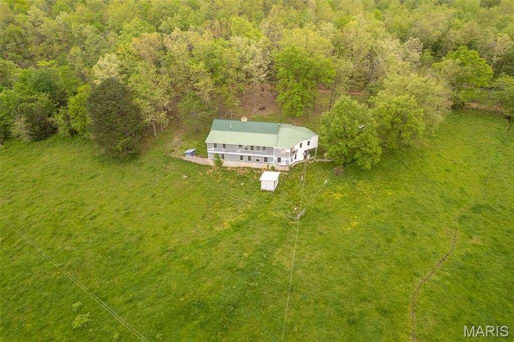 227 Acres of Land with Home for Sale in Mill Spring, Missouri