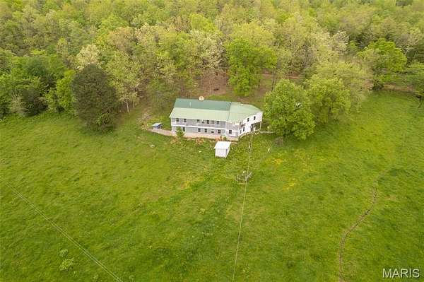 227 Acres of Land with Home for Sale in Mill Spring, Missouri