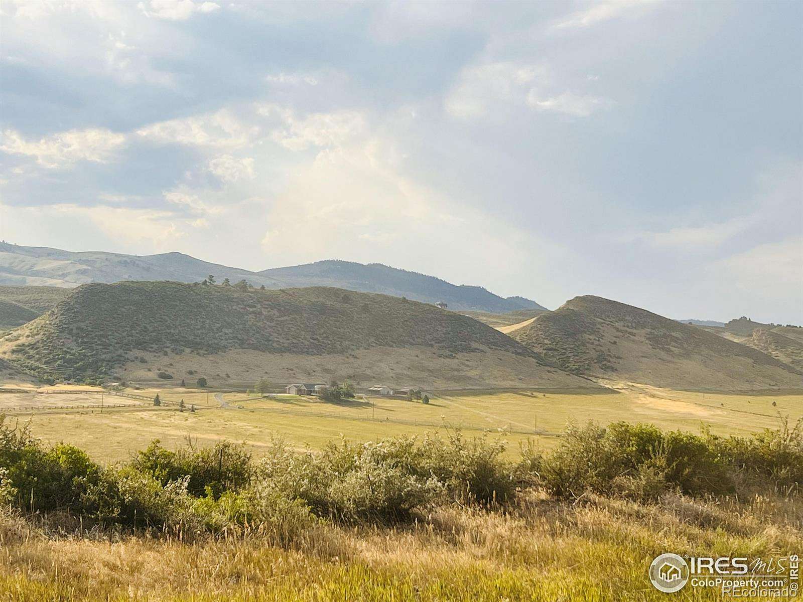 36.8 Acres of Agricultural Land with Home for Sale in Loveland, Colorado