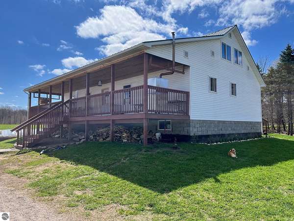 30 Acres of Agricultural Land with Home for Sale in Brethren, Michigan