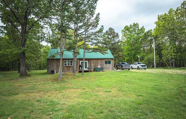 205 Acres of Recreational Land with Home for Sale in Raymondville, Missouri