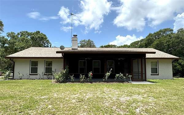 3.8 Acres of Residential Land with Home for Sale in Oak Hill, Florida