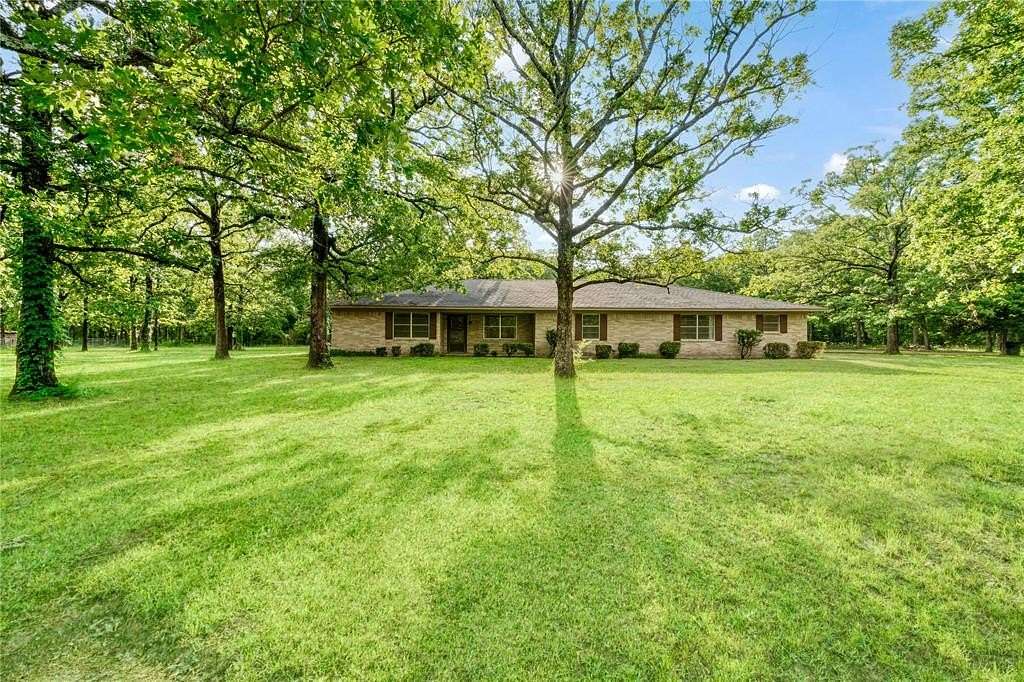 7 Acres of Residential Land with Home for Sale in Paris, Texas