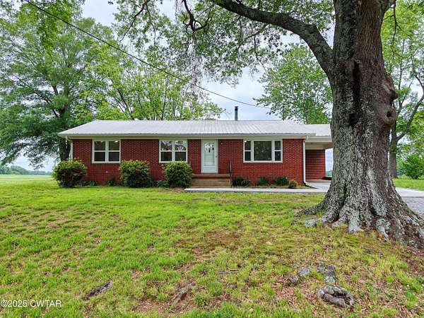 1.73 Acres of Residential Land with Home for Sale in McKenzie, Tennessee