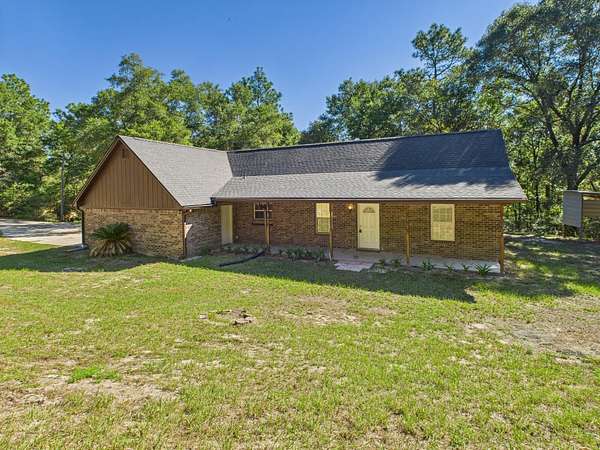 5.26 Acres of Residential Land with Home for Sale in Holt, Florida