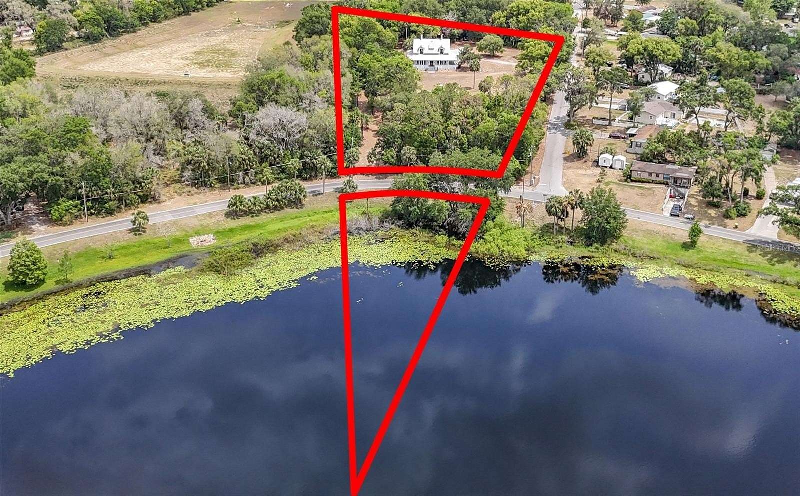2.7 Acres of Residential Land with Home for Sale in Fruitland Park, Florida