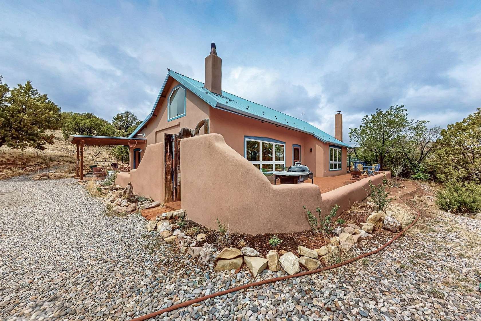 5.66 Acres of Residential Land with Home for Sale in Lamy, New Mexico