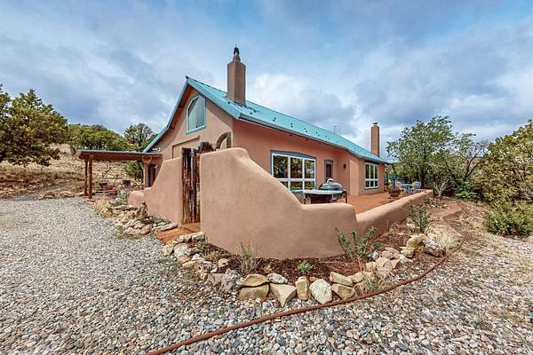 5.66 Acres of Residential Land with Home for Sale in Lamy, New Mexico