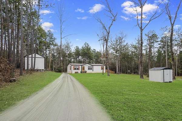 2.33 Acres of Residential Land with Home for Sale in Brookeland, Texas