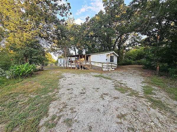 2 Acres of Residential Land with Home for Sale in Jewett, Texas