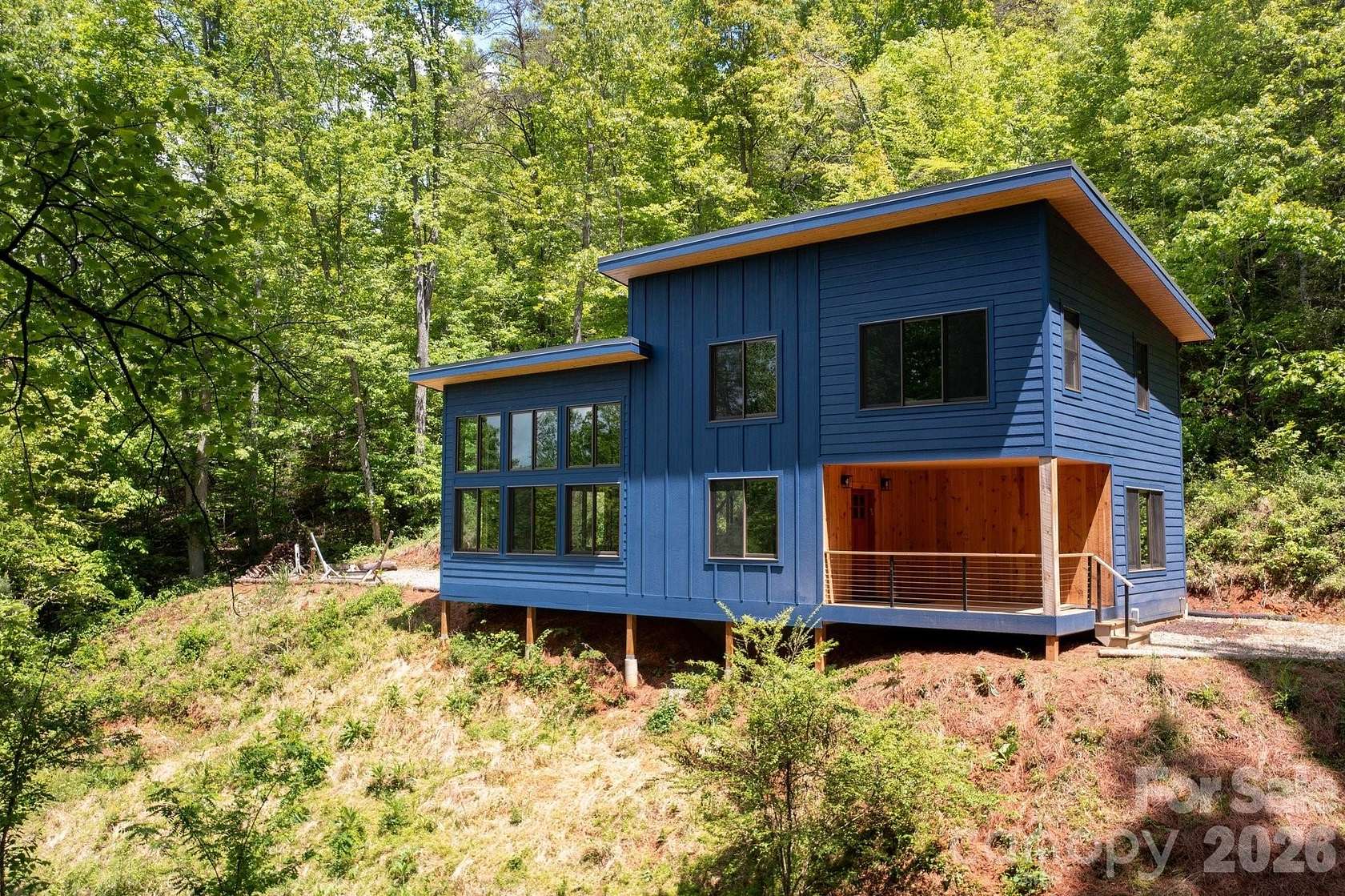 7.66 Acres of Land with Home for Sale in Marshall, North Carolina