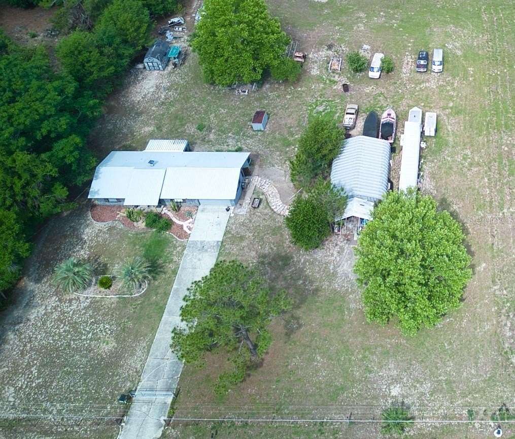 5.25 Acres of Residential Land with Home for Sale in Lady Lake, Florida