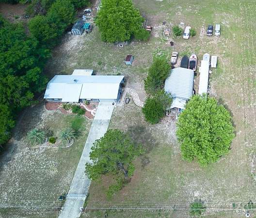 5.25 Acres of Residential Land with Home for Sale in Lady Lake, Florida
